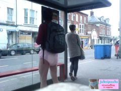 in the pink waitng for a bus