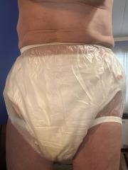 Wet cloth diaper and plastic pants