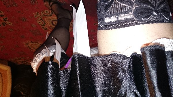 Super pretty stockings
The short maids dress does little to hide the huge diaper underneath :)
