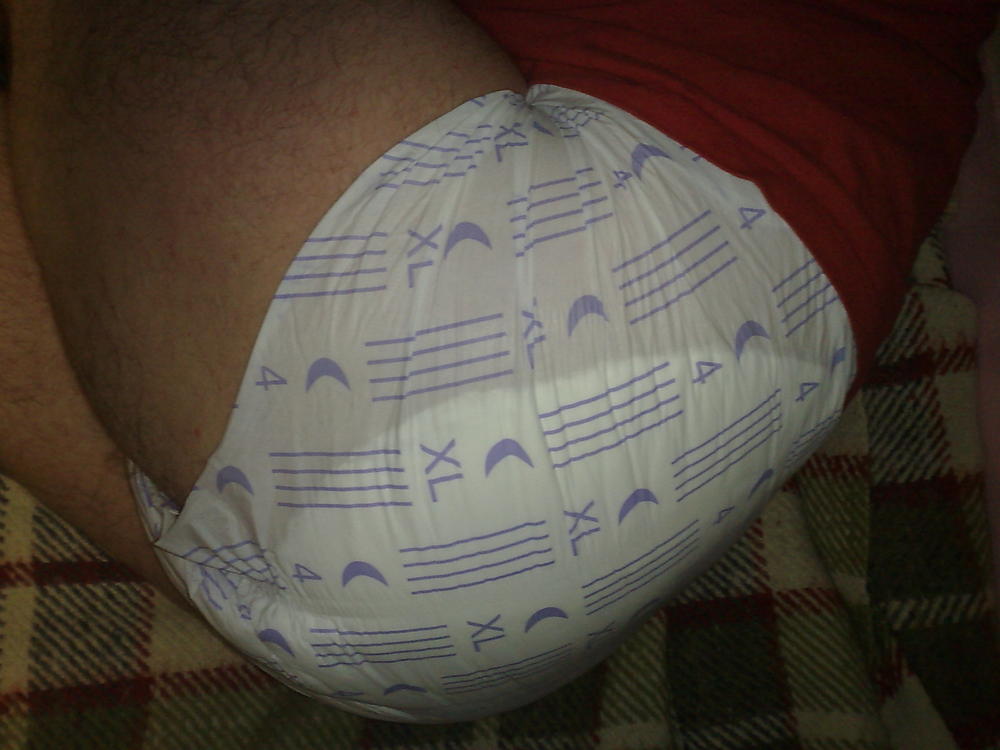 Diapered boy going to sleep
