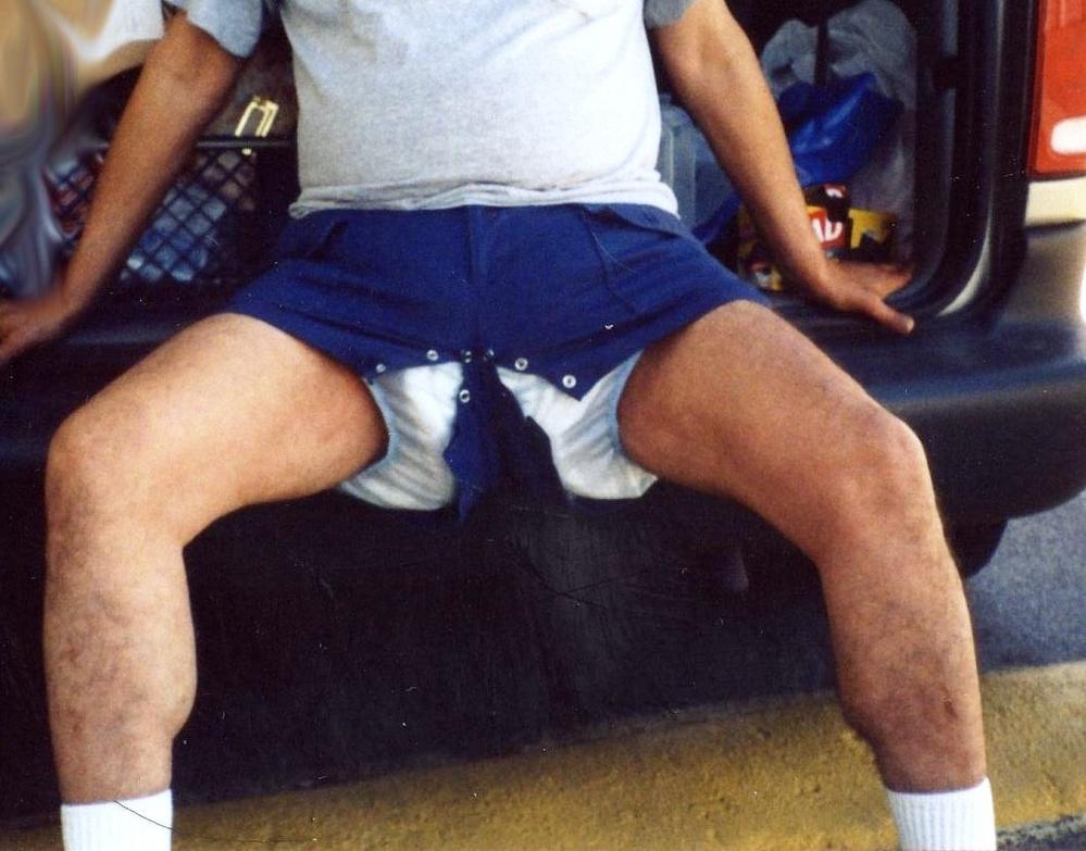 My Wife puts snaps in all of my shorts too.
Out in a public car park, waiting for my wife to get a set of clean diapers out of my diaper bag.  Once in a while, when i've pooped and we're going to be with friends or not returning home for a longtime.  It's best to avoid diaper rash.  So, my wife will change my diapers in the back of our minivan.  Having snaps in my shorts, makes diaper changes easier for her, and minimizes the amount of time that people passing by might want to get a closer look.  know what i mean?
Keywords: public_cloth_diapers_plastic_uninhibited_wet_diaperchange